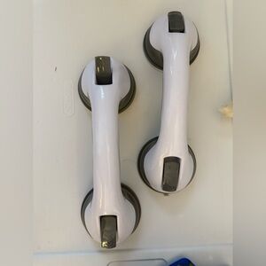 Set of 2 suction cup grab bars or safety handles used for stability in bathrooms